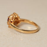1980's 18K Yellow Gold Ruby and Diamond Askew Halo Ring, Size US 6.25