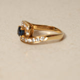 Mouawad 1990's 18K Yellow Gold and Sapphire Diamond Bypass Ring, Size US 6