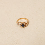 Mouawad 1990's 18K Yellow Gold and Sapphire Diamond Bypass Ring, Size US 6