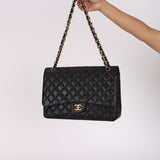 Chanel Turnlock Maxi Classic Single Flap Black Caviar 2010 GHW