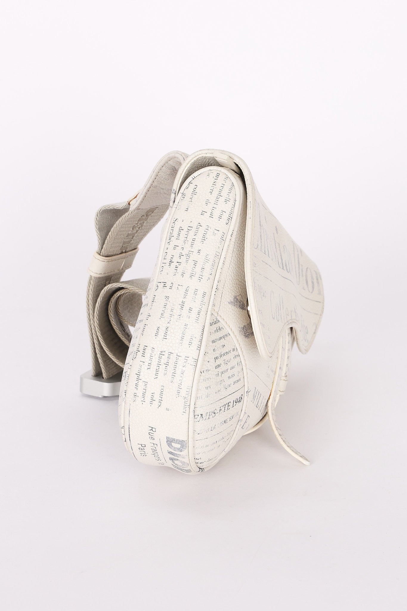 Christian Dior X Daniel Arsham Newspaper Print Saddle Crossbody Bag