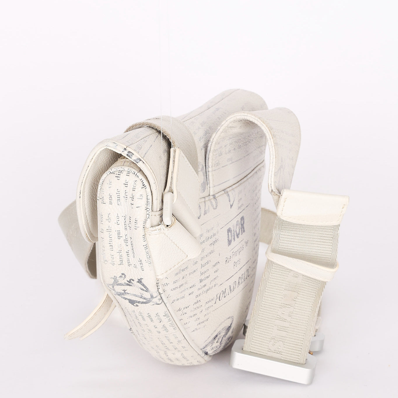 Christian Dior X Daniel Arsham Newspaper Print Saddle Crossbody Bag