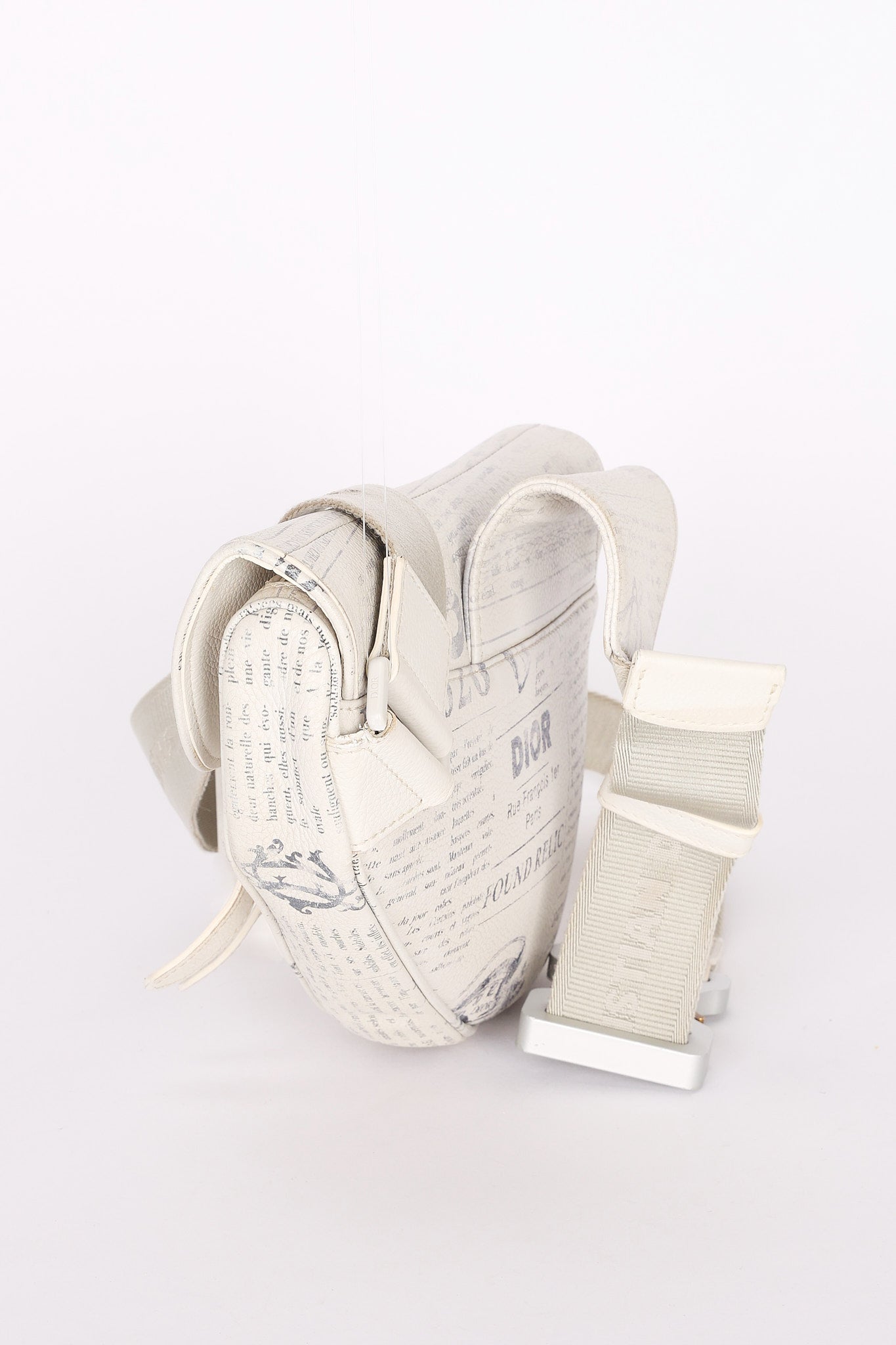 Christian Dior X Daniel Arsham Newspaper Print Saddle Crossbody Bag