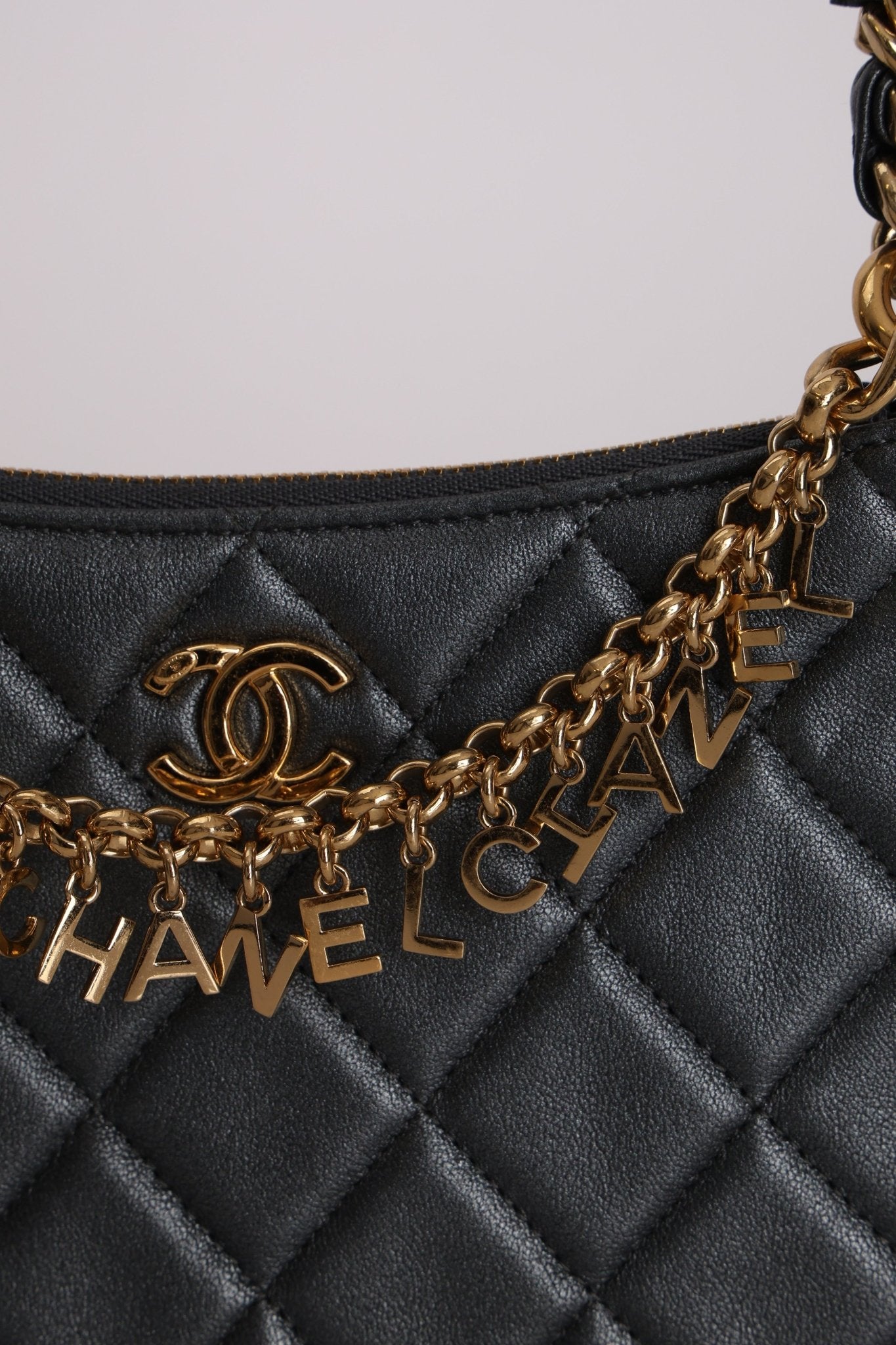 Chanel 2021 Metallic Logo Charms Quilted Pochette - FashioNica