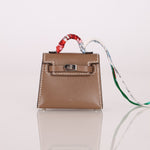 Hermès 2020 Etoupe Tadelakt Micro Kelly Twilly Bag Charm - FashioNica