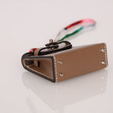 Hermès 2020 Etoupe Tadelakt Micro Kelly Twilly Bag Charm - FashioNica