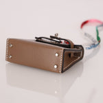 Hermès 2020 Etoupe Tadelakt Micro Kelly Twilly Bag Charm - FashioNica