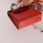 Hermès 2020 Rouge Vif Tadelakt Micro Kelly Twilly - FashioNica