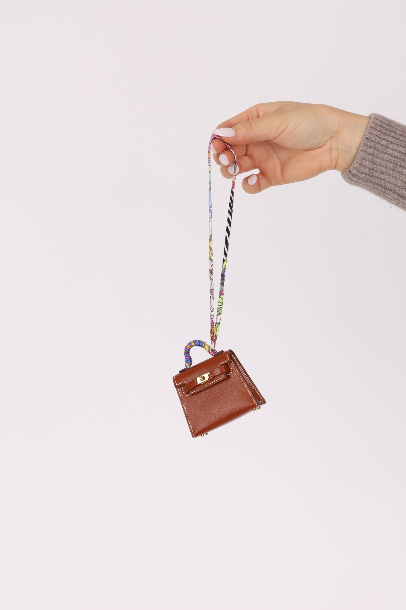 Hermès 2021 Gold Tadelakt Micro Kelly Twilly Bag Charm GHW - FashioNica