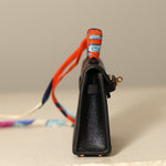 Hermès 2023 Micro Kelly Noir Tadelakt Twilly Bag Charm - FashioNica