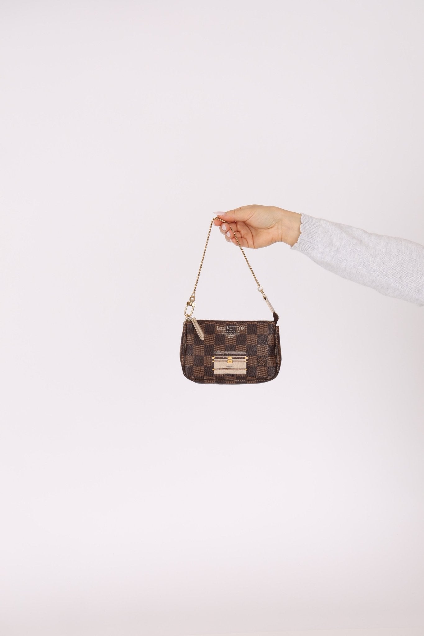 Louis Vuitton Damier Ebene Trunks and Locks Mini Pochette - FashioNica